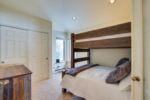 a bedroom with two bunk beds and a desk at East Village Duplex at Copper Mountain Resort! in Frisco