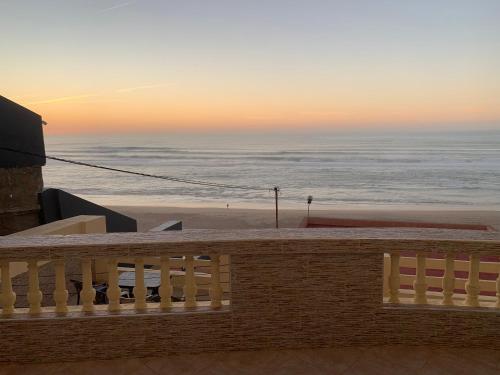 a view of the ocean from the balcony of a beach at EL MAR BEACH in Moulay Bousselham