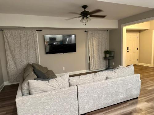 a living room with a white couch and a flat screen tv at 2 BR 1 BA apartment in Newnan