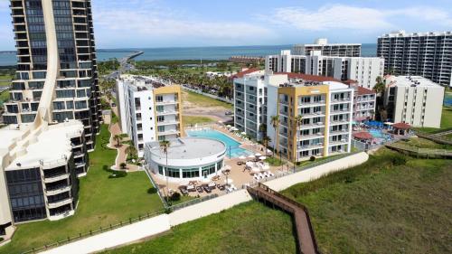 an aerial view of a city with tall buildings at Peninsula Island Resort & Spa - Beachfront Property at South Padre Island in South Padre Island