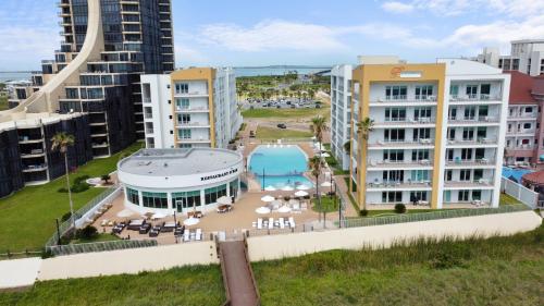 an aerial view of buildings in a city at Peninsula Island Resort & Spa - Beachfront Property at South Padre Island in South Padre Island