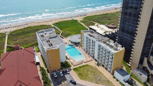 an aerial view of a hotel and the beach at Peninsula Island Resort & Spa - Beachfront Property at South Padre Island in South Padre Island