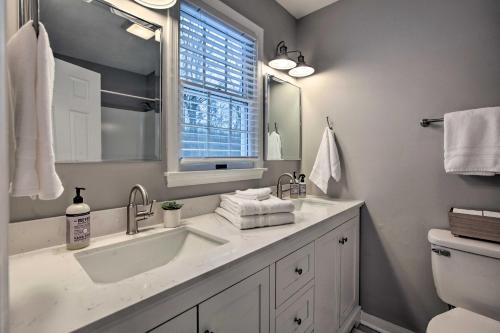 a bathroom with a sink and a window at Hot Tub! Charming Cottage With Horse Farm View in Afton