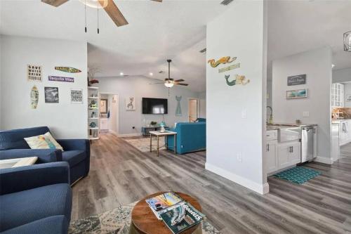 a living room with a couch and a table at 3bed3bath Waterfront Home with an Amazing View! in Hernando Beach