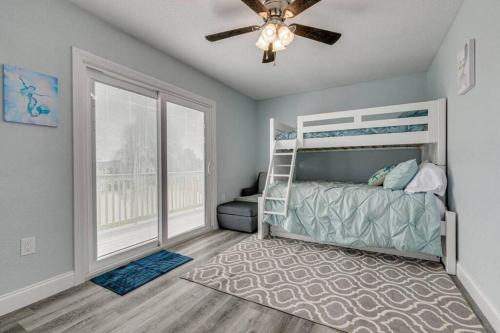 a bedroom with a bed and a ceiling fan at Huge discounts though end of the 2023! in Hernando Beach