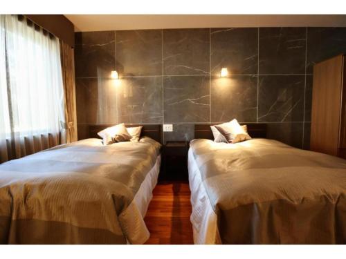 Katil atau katil-katil dalam bilik di Hakuba park hotel - Vacation STAY 96011v