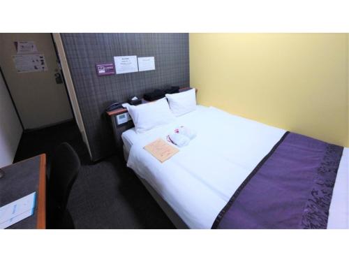 Posteľ alebo postele v izbe v ubytovaní Hotel Area One Oita - Vacation STAY 99748v