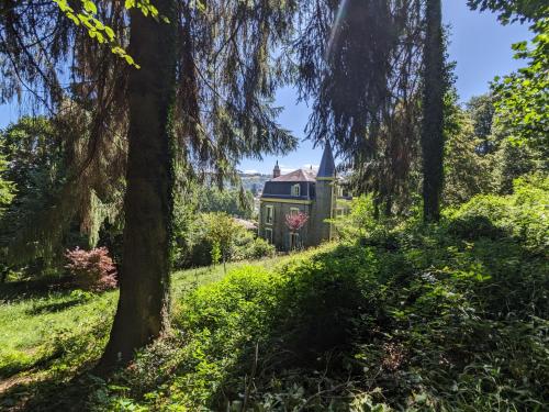an old house in the middle of a forest at Villa Morton - Domaine du Grand Tourmalet Pic du Midi in Bagnères-de-Bigorre