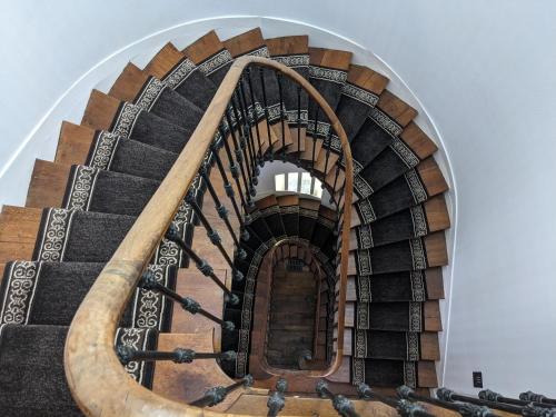a spiral staircase in a building at Villa Morton - Domaine du Grand Tourmalet Pic du Midi in Bagnères-de-Bigorre