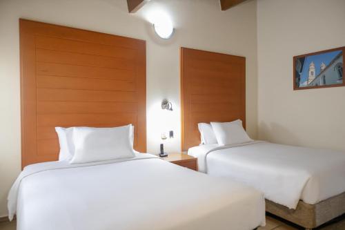 Uma cama ou camas num quarto em Hotel Faranda Bolivar Cucuta, a member of Radisson Individuals