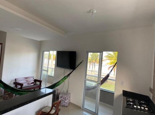 Télévision ou salle de divertissement dans l'établissement Casa Condomínio FRENTE PARA O MAR
