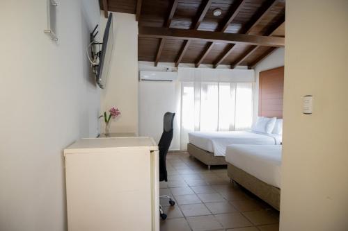 Uma cama ou camas num quarto em Hotel Faranda Bolivar Cucuta, a member of Radisson Individuals