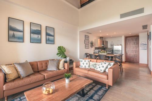 a living room with a couch and a table at Wonderful Apt at Casa de Campo in El Infiernito