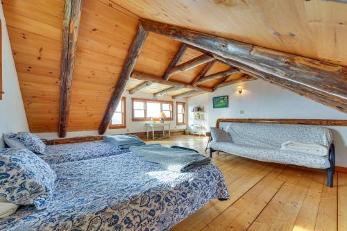 a bedroom with two beds in a room with wooden ceilings at Remote Escape Vermont Cabin with Mountaintop Views! 