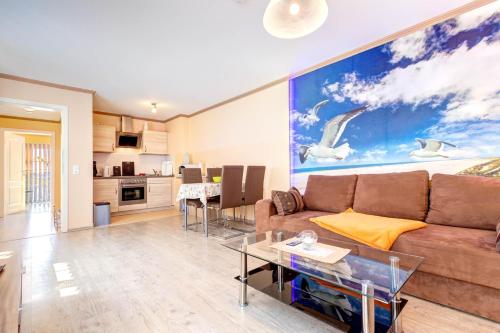 a living room with a couch and a table at Koserow, Koserower Strand - App in Ostseebad Koserow