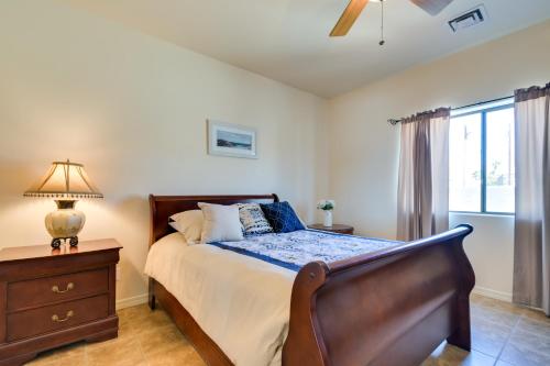 a bedroom with a bed and a dresser and a window at Bright Cottage with Pool and Spa - 5 Mi to Lake Havasu in Lake Havasu City