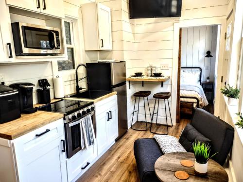 a small kitchen and living room in a tiny house at Tiny Home Big Fun in Knoxville