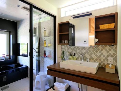 a bathroom with a sink and a shower at Class Vesso Tateshina - Vacation STAY 51980v in Chino