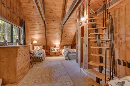 a log cabin with a spiral staircase in a room at Holly House on the West Shore - New Hot Tub, Wood Fireplace, Near Skiing in Tahoe City