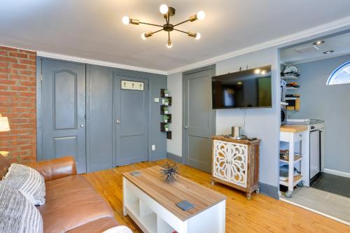 a living room with a couch and a table at Beacon Apt with Patio and Grill Walk to Main St! in Beacon