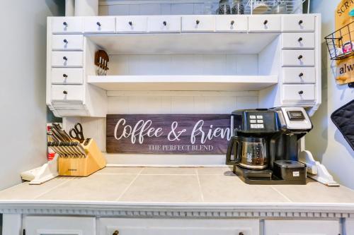 a coffee and brew sign in a cupboard at Beacon Apt with Patio and Grill Walk to Main St! in Beacon