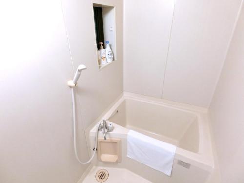 a bathroom with a sink and a mirror at futaba heights - Vacation STAY 15532 in Tokyo