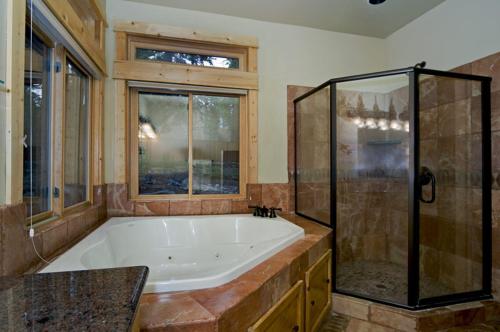 a large bathroom with a tub and a shower at Olive Branch - Private Hot Tub, Media Room, Pet-Friendly, Near Northstar! in Carnelian Bay