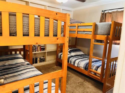 two wooden bunk beds in a room with at 5 Bedrooms with pool near beach in Clearwater Beach