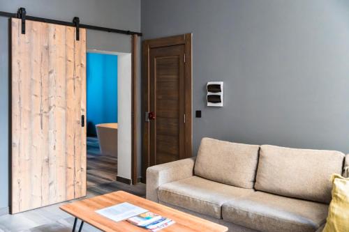 a living room with a couch and a table at Valletta Stylish 2BR Flat by ArcoBnb in Valletta