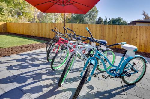 a group of bikes parked next to an umbrella at Modern Wheat Ridge Home with Private Hot Tub and Sauna in Wheat Ridge