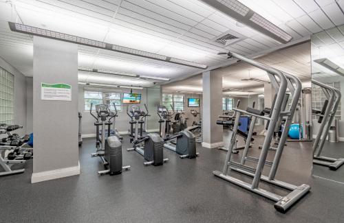 a gym with several treadmills and cardio machines at Tides on Hollywood Beach in Hollywood