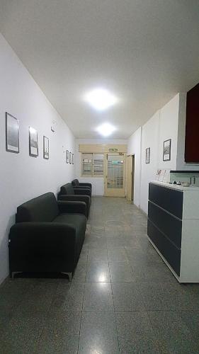 a living room with couches in a room at HOTEL RESIDENCIAL CAMACHO in Cordoba