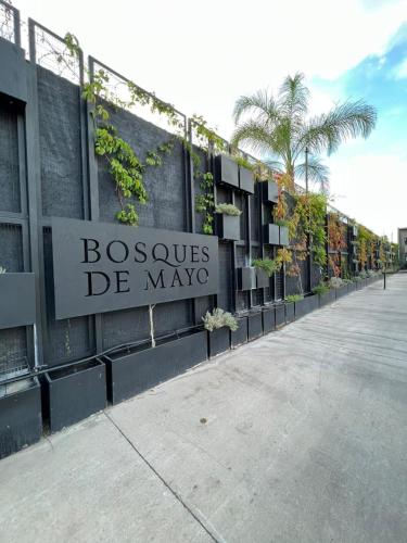 a building with a sign that reads bosques de mayo at Bosques de Mayo Departamento 4 in Maipú