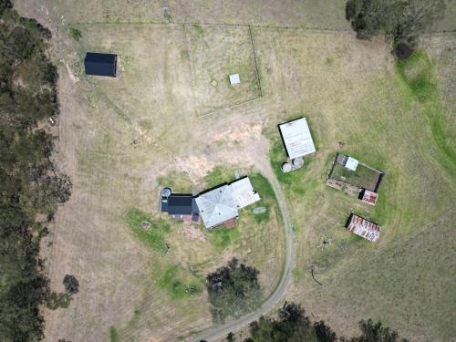 an overhead view of a yard with a house at The Glass Ceiling 360 degree Mount View Hideaway in Mount View