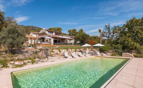 een zwembad voor een huis bij Villa Paloma - nature meets design in Tourrettes-sur-Loup