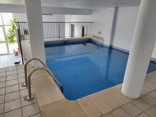 a large swimming pool in a building at Santo Cristo 11 in Frigiliana