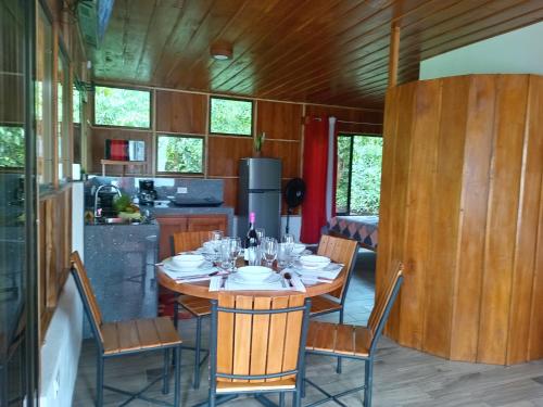 a dining room with a table and chairs in a kitchen at Gambas Lodge in Fortuna