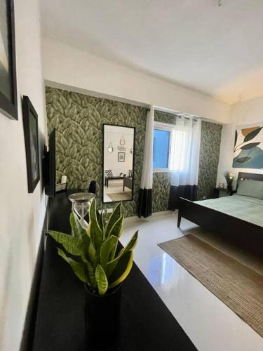 Ένα ή περισσότερα κρεβάτια σε δωμάτιο στο Apartamento vista al mar cerca universidad malecón zona colonial