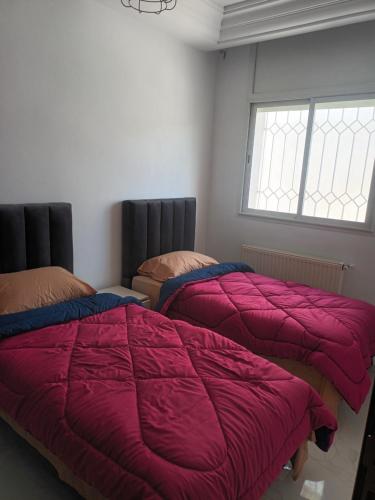 מיטה או מיטות בחדר ב-Dar NZ