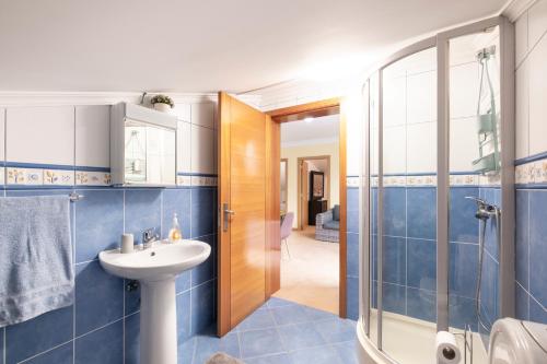 a bathroom with a sink and a shower at Sara House in Ponta do Sol