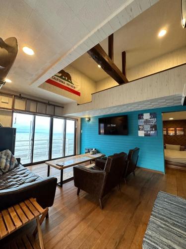 a living room with a ping pong table and chairs at SunSet Villa - Vacation STAY 27888v in Nagaoka