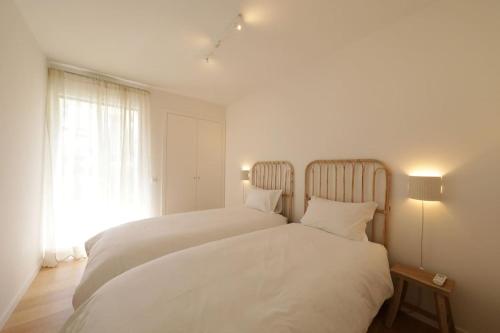 Luxury 2BR Retreat with Pool & Sunset Garden