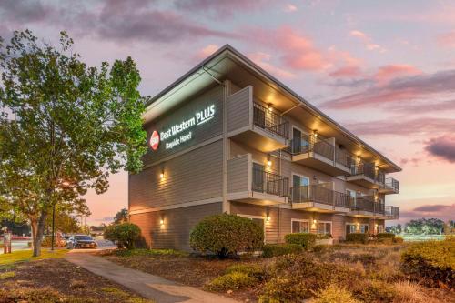 an apartment building with a sign on it at Best Western Plus Bayside Hotel in Oakland