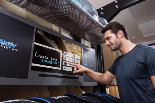 a man is pointing at a chinese culinary appliance at DoubleTree by Hilton Jakarta - Diponegoro in Jakarta