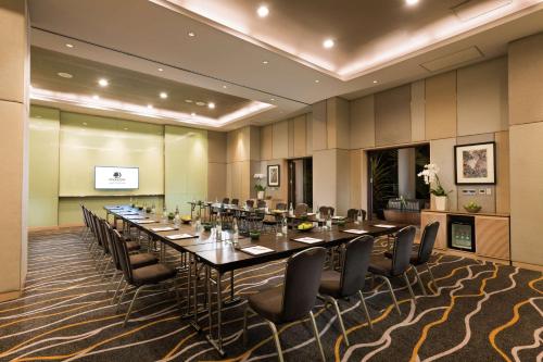 a conference room with a long table and chairs at DoubleTree by Hilton Jakarta - Diponegoro in Jakarta