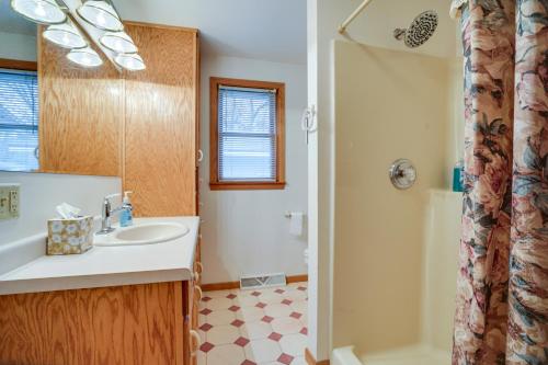 a bathroom with a sink and a shower at Family-Friendly Home in Pepin Walk to Main St! in Pepin