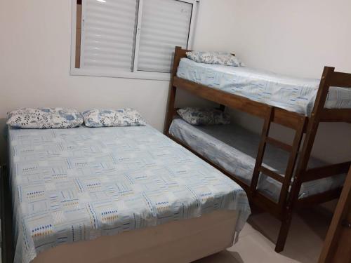 Postel nebo postele na pokoji v ubytování Apartamento Em Balneário Mogiano
