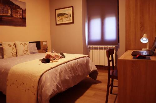 Säng eller sängar i ett rum på Casa-museo Genia Trigo