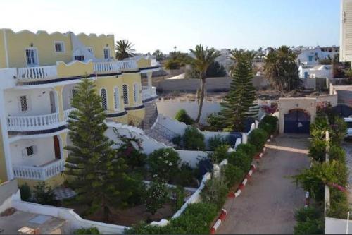 an aerial view of a house with trees and bushes at Laguna in Taguermess