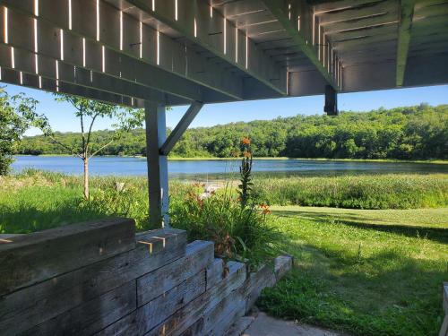 a view of a lake from under a bridge at Quaint Cabin with Private Dock in Fergus Falls